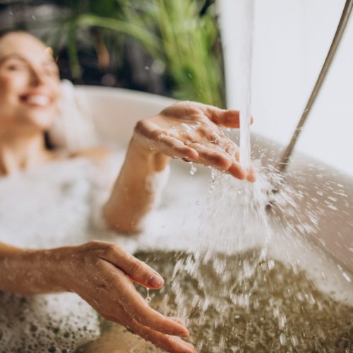 Woman relaxing in bath with bubbles